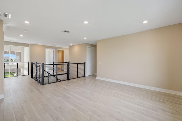 spare room featuring light hardwood / wood-style floors