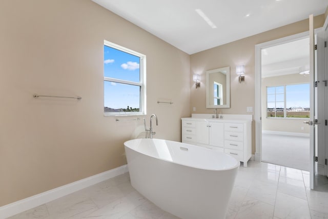 bathroom with a bathtub and vanity