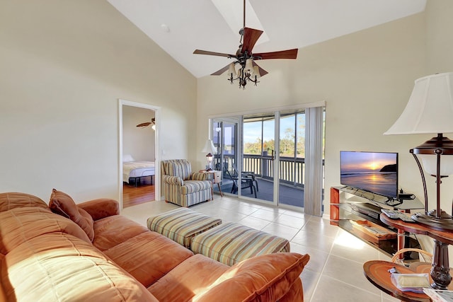 living room with light tile patterned floors, high vaulted ceiling, and ceiling fan