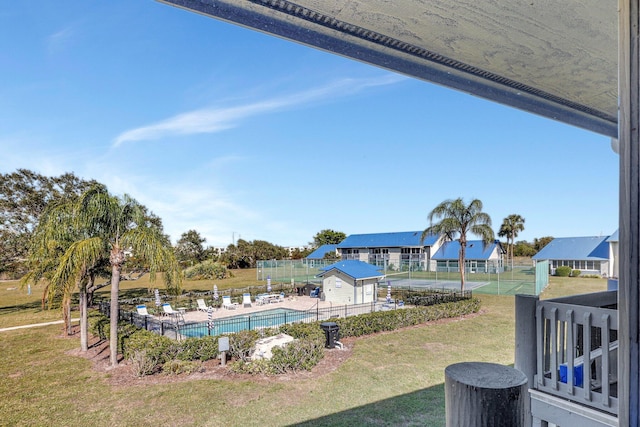 view of swimming pool featuring a lawn