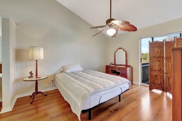 bedroom featuring ceiling fan, light hardwood / wood-style floors, and vaulted ceiling