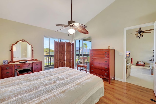 bedroom featuring access to exterior, ceiling fan, light hardwood / wood-style floors, and vaulted ceiling