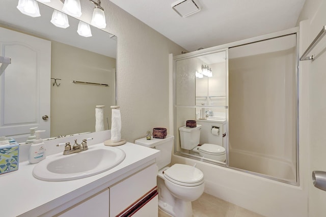 full bathroom featuring tile patterned flooring, vanity, toilet, and shower / bath combination with glass door