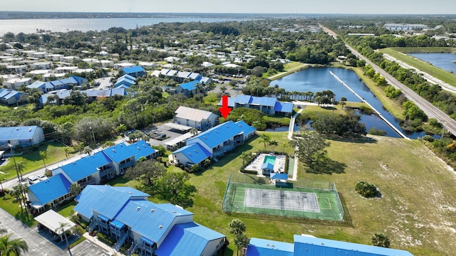 birds eye view of property with a water view