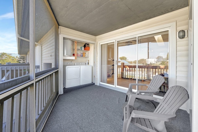 balcony with separate washer and dryer