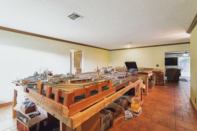 dining space with crown molding