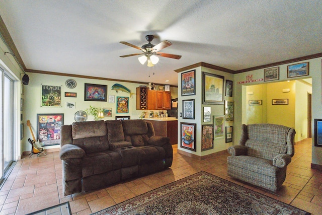 living room with ceiling fan, a textured ceiling, and ornamental molding