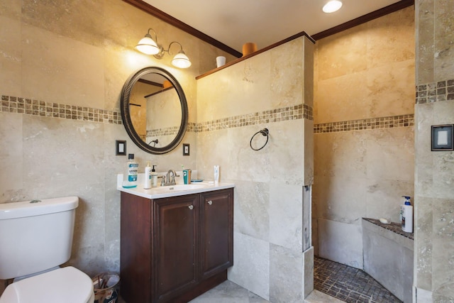 bathroom featuring toilet, vanity, tile walls, and ornamental molding