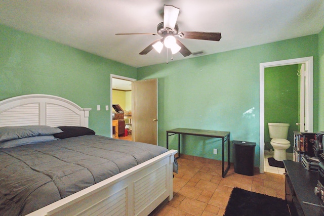 bedroom with ensuite bath and ceiling fan