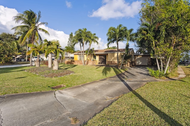 single story home featuring a front yard