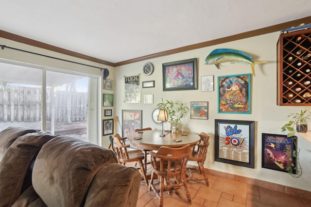 dining area featuring crown molding