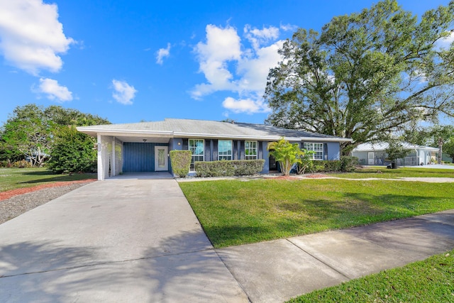 ranch-style house featuring a carport and a front yard