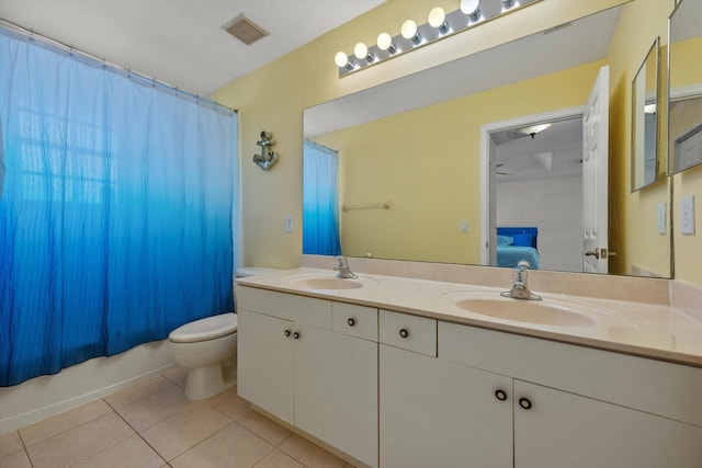 full bathroom featuring toilet, vanity, tile patterned floors, and shower / bathtub combination with curtain