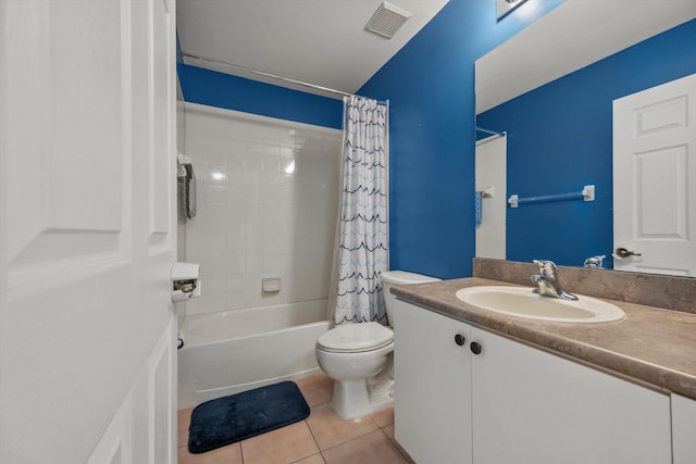 full bathroom with tile patterned flooring, shower / bath combo, vanity, and toilet