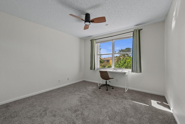 unfurnished room with carpet flooring, ceiling fan, and a textured ceiling