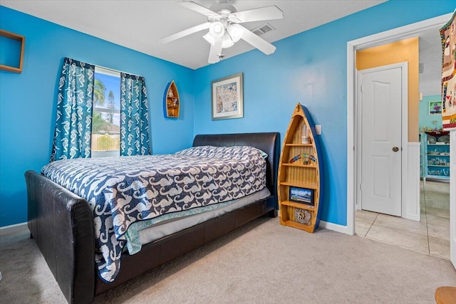 bedroom with ceiling fan and carpet