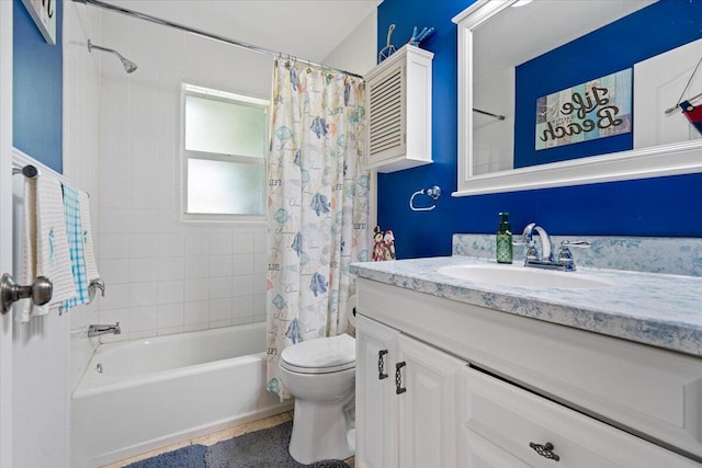 full bathroom with toilet, shower / tub combo with curtain, and vanity