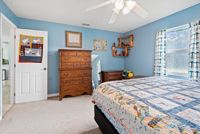 carpeted bedroom featuring ceiling fan