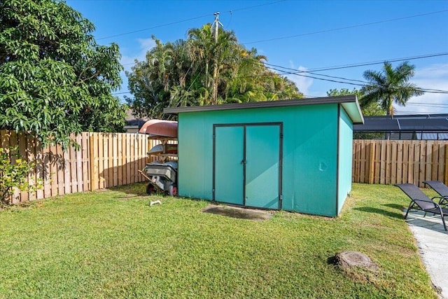 view of outbuilding with a lawn