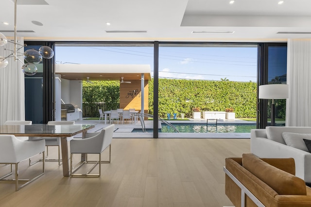 entryway featuring hardwood / wood-style flooring and floor to ceiling windows