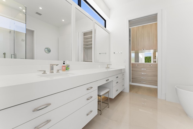 bathroom featuring vanity and an enclosed shower