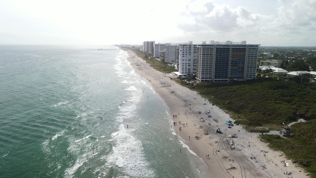 aerial view featuring a water view and a beach view