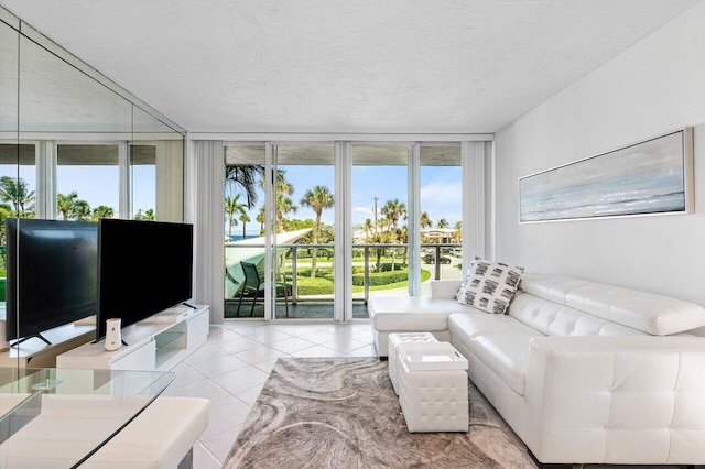 tiled living room with a wall of windows and a textured ceiling