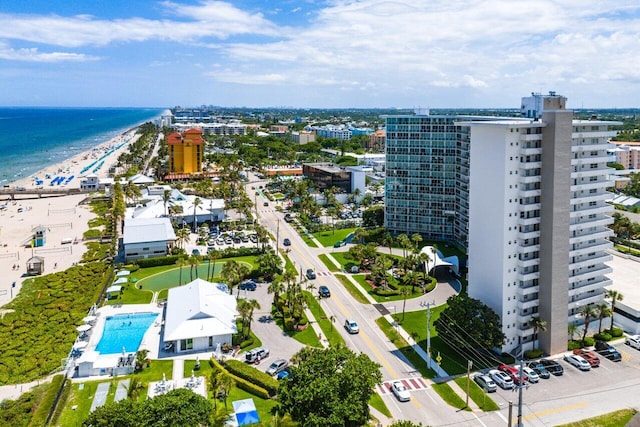 bird's eye view featuring a water view and a view of the beach