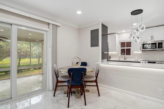 dining area with electric panel, sink, and ornamental molding