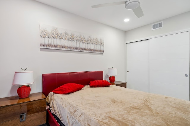 bedroom with ceiling fan and a closet