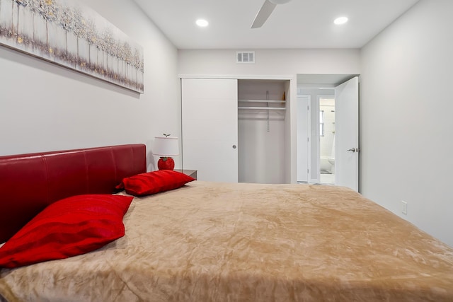 bedroom with ceiling fan and a closet