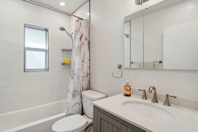 full bathroom featuring vanity, shower / bath combo, and toilet