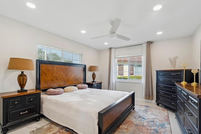 bedroom featuring ceiling fan and multiple windows