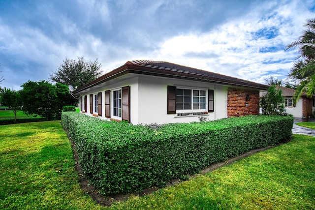 view of property exterior featuring a yard