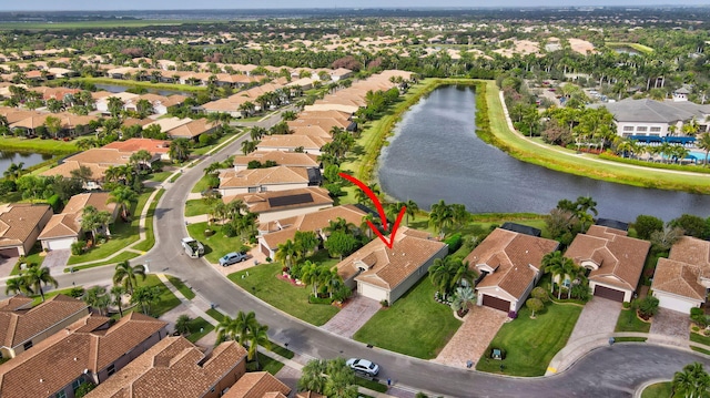 birds eye view of property with a water view