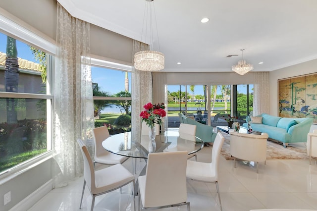 dining space with light tile patterned floors, a wealth of natural light, and a notable chandelier