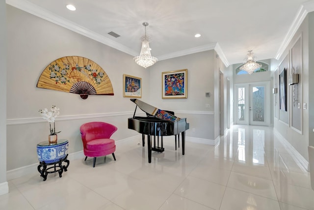 entryway with a chandelier, light tile patterned floors, and crown molding