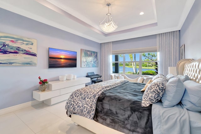 bedroom featuring a tray ceiling, crown molding, light tile patterned flooring, and a notable chandelier