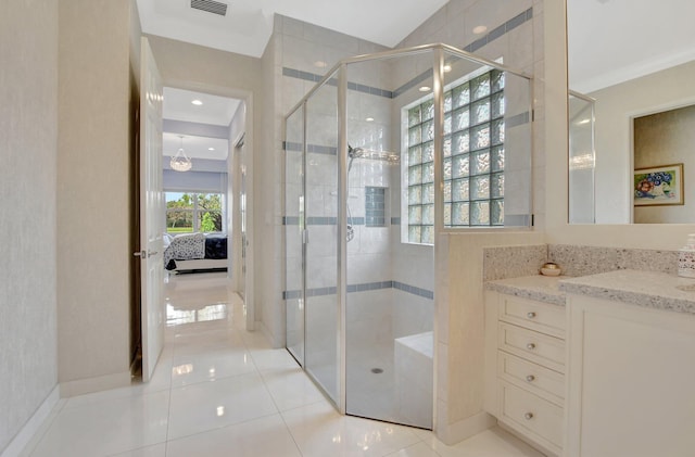 bathroom featuring vanity, tile patterned floors, a shower with shower door, and crown molding