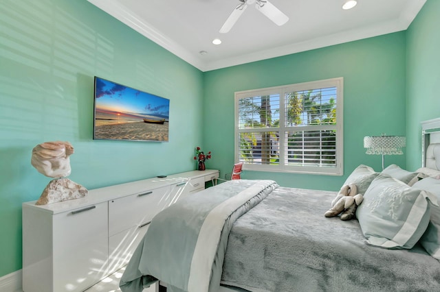 bedroom with ceiling fan and ornamental molding