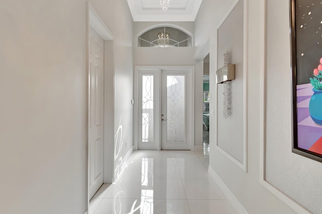 foyer entrance with plenty of natural light and an inviting chandelier