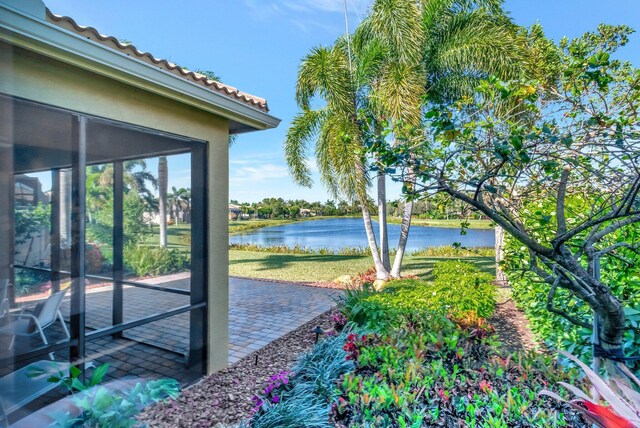 view of yard featuring a patio area and a water view