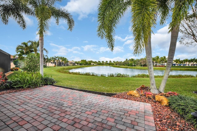 view of patio with a water view