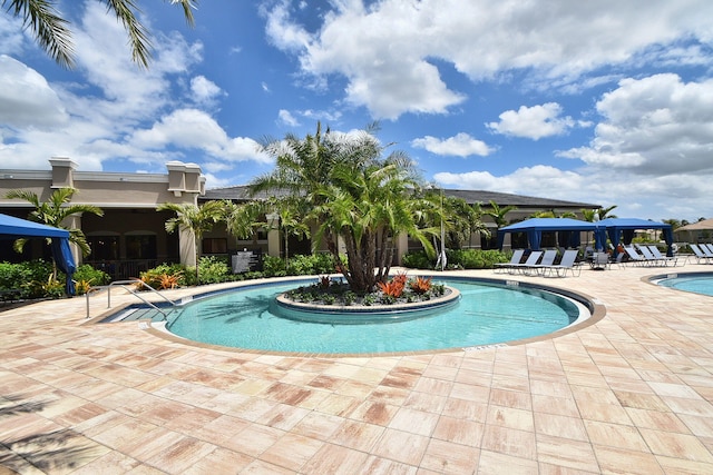 view of swimming pool featuring a patio area