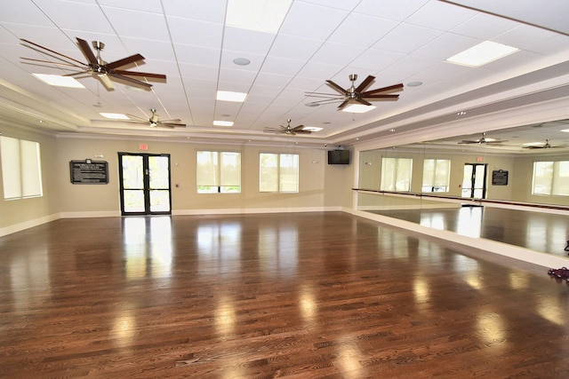 unfurnished room with a raised ceiling and dark hardwood / wood-style flooring