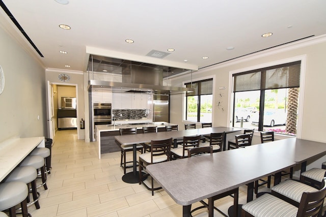 dining space featuring ornamental molding