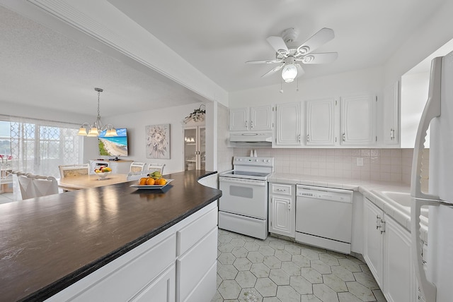 kitchen with white cabinetry, decorative light fixtures, backsplash, white appliances, and ceiling fan with notable chandelier