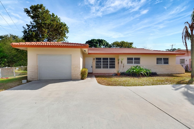 ranch-style home featuring a garage