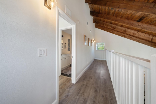 hall featuring wood ceiling, vaulted ceiling with beams, and hardwood / wood-style flooring