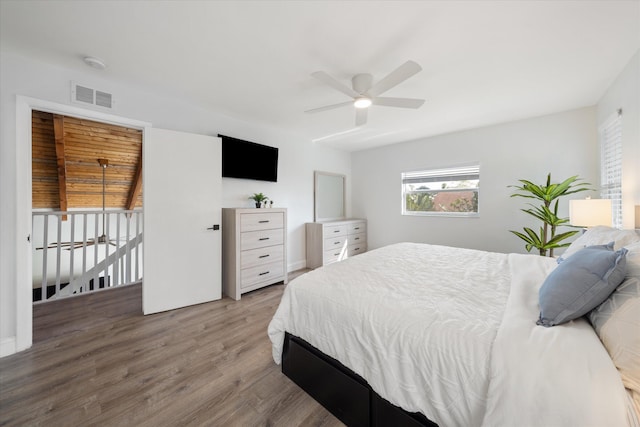 bedroom with wood-type flooring and ceiling fan